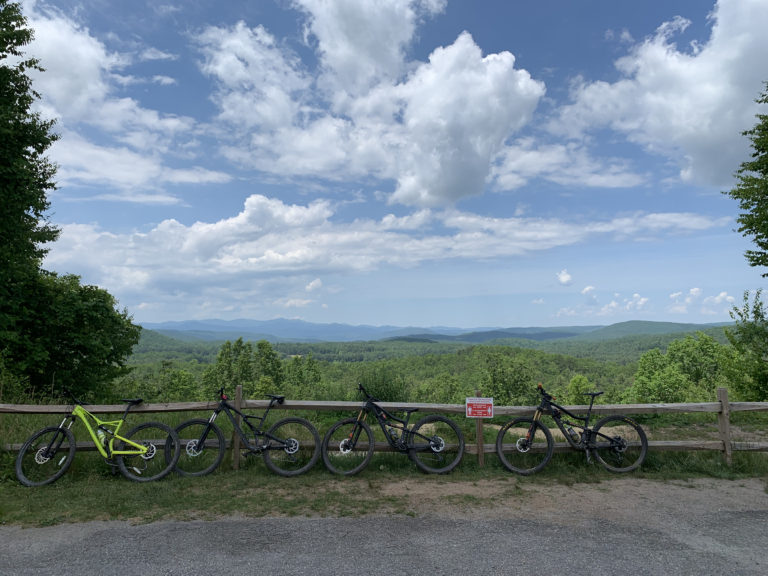 4 bikes with mountains in the distance